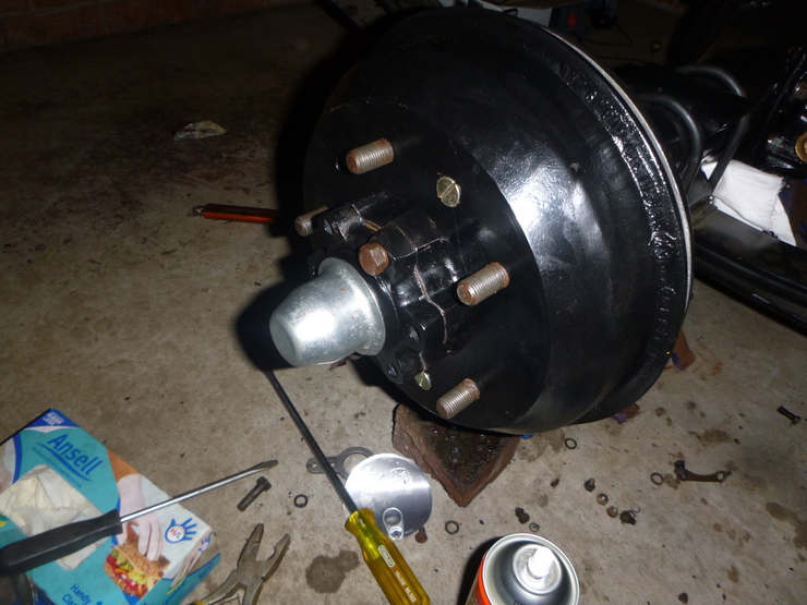 Rear hubcap and brake drum installed