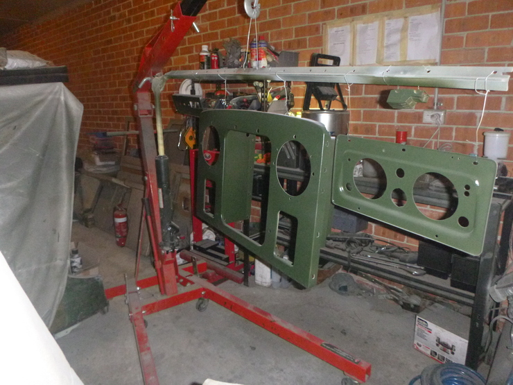 Front view of painted panels hanging to dry