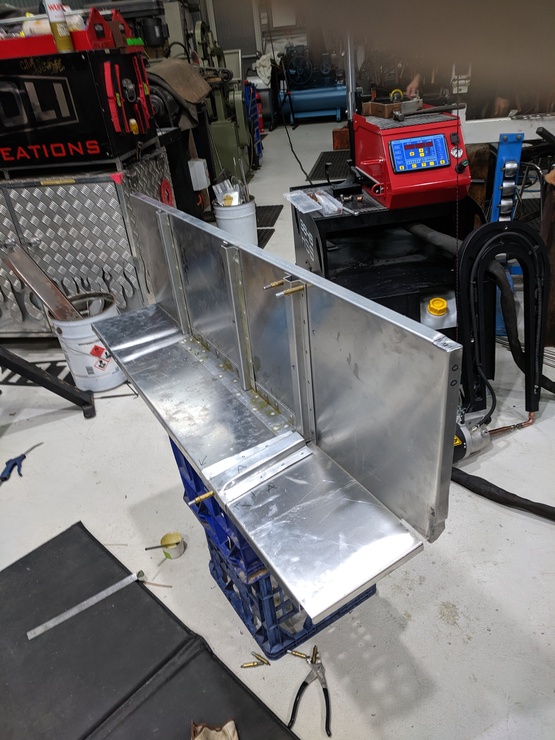 Bracing being spot-welded onto seatbox