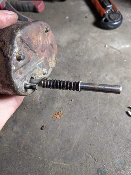 Circlip removed, spring halfway removed along shaft