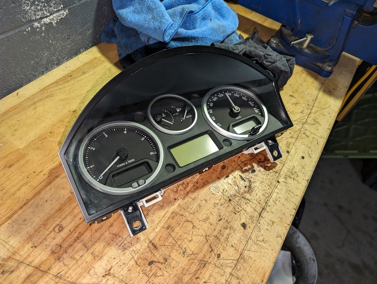 Gauge cluster sitting on workbench